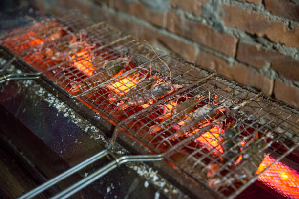 istock The prawns being grilled 2191619446