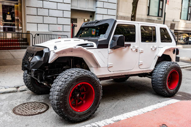 New York City, USA - April 28, 2024: Jeep Gladiator pickup truck car parked outside, left side view.