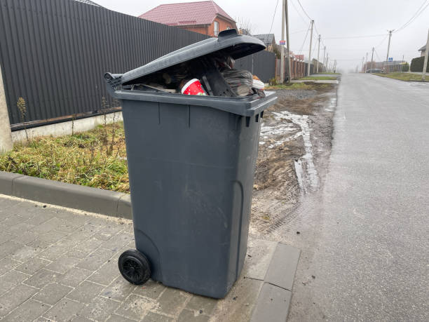 istock A trash can overflowing with trash, showing bags and various waste 2191626629