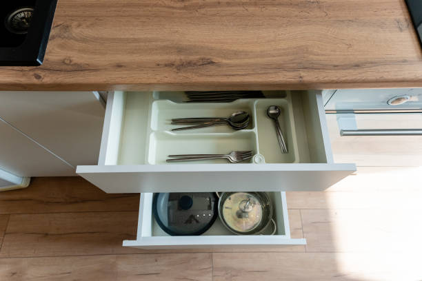istock A kitchen drawer is filled with utensils, pots, and pans for cooking 2191628863