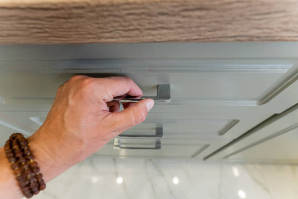 istock A person is using a screwdriver to open a drawer in their home 2191628889