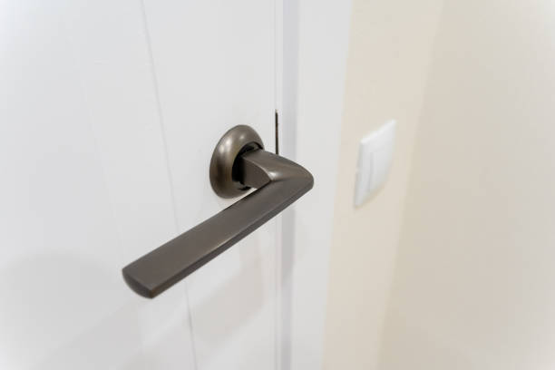istock This detailed closeup image presents a beautifully crafted door handle mounted on an immaculate white door, emphasizing the exquisite intricacies and thoughtful design elements involved 2191628965