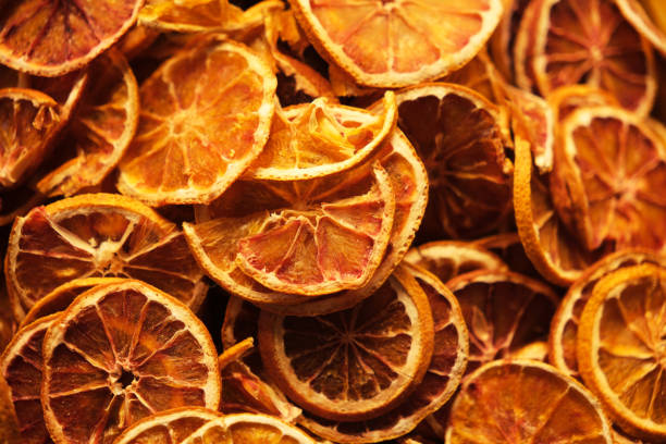 istock Dried orange citrus slices background 2191630422