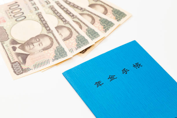 istock Pension book and money on white background 2191633262
