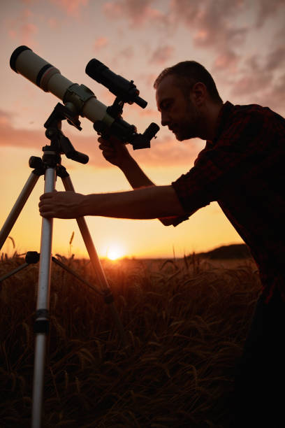 istock Astronomer looking at sky with a telescope. 2191635574