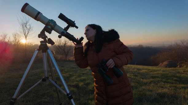 istock Amateur astronomer observing skies with telescope. 2191635588