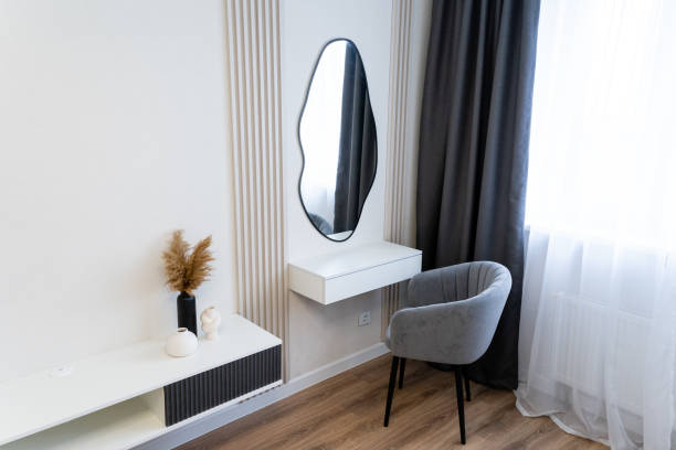 istock Step into a beautifully designed interior featuring a chic mirror and a comfortable chair, all set within a vibrant, welcoming room that emanates a sense of positivity 2191638584