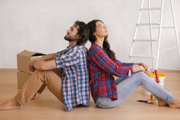 istock Tired Couple Resting on Floor During DIY Home Renovation 2191638696