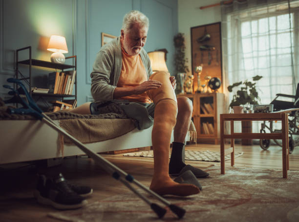 istock senior disabled man sitting on bed in his room, morning routine 2191639327