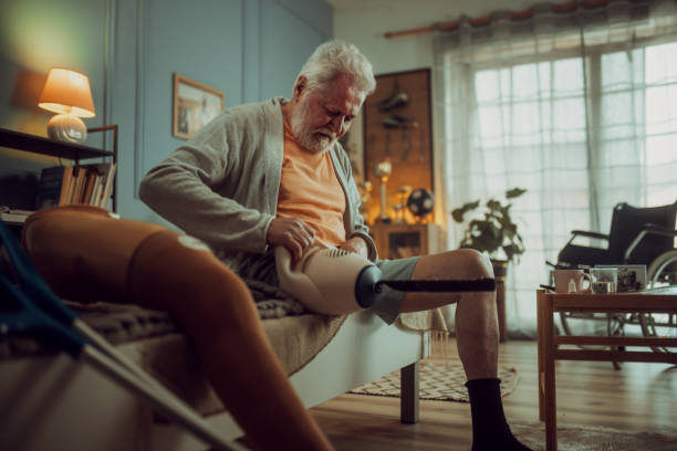 istock senior disabled man sitting on bed in his room, morning routine 2191639357