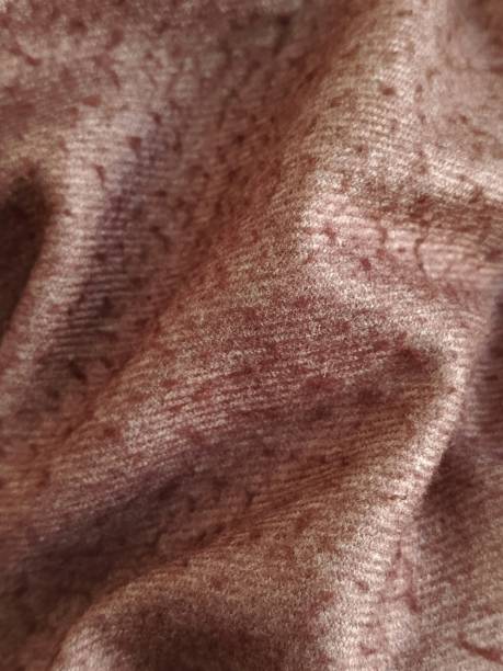 istock Crinkled fabric in Mocha Mousse color. Warm brown wool fabric for sewing. Background for text. Textile factory. Brown blanket. 2191641482