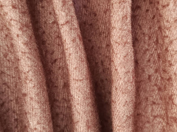istock Crinkled fabric in Mocha Mousse color. Warm brown wool fabric for sewing. Background for text. Textile factory. Brown blanket. 2191641934