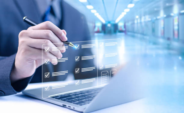 istock Businessman working on computer using laptop. Concept of business performance tracking and evaluation. Document management system DMS. Performance checklist evaluation form. 2191644366