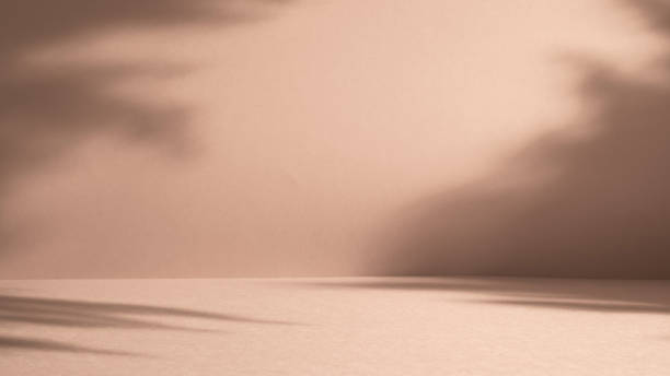 istock Simple background with light and shadows in warm mocha mousse tones 2191646300