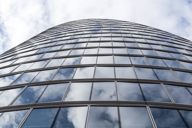 istock Modern Glass Facade Reflecting the Sky: Abstract Urban Architecture 2191652822
