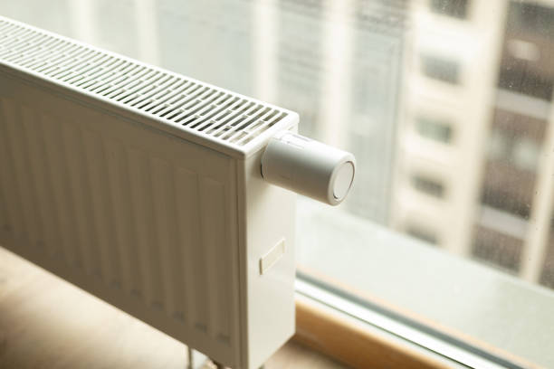 istock battery heating knob, heating in an apartment, home. Heating prices. 2191656284