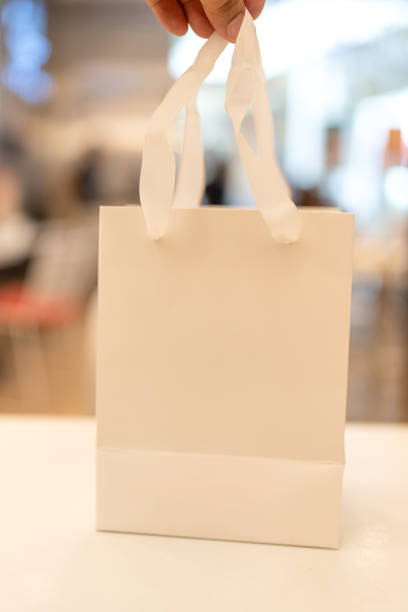 istock A white paper bag with fabric handles 2191657397