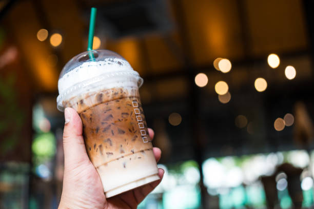 istock Someone hand holding a plastic cup of iced Mocha coffee and. Ready to go package. 2191657501