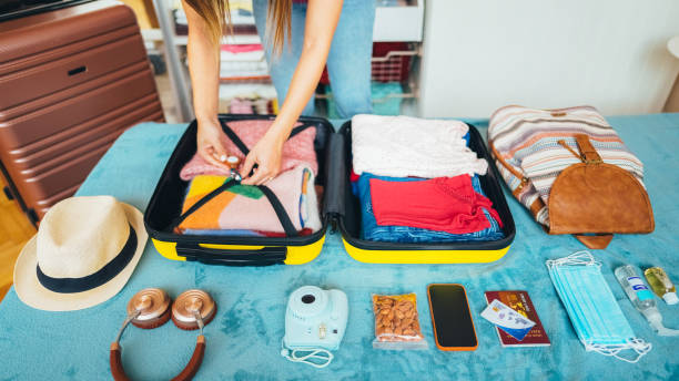 istock Woman packing suitcase for travel 2191659751