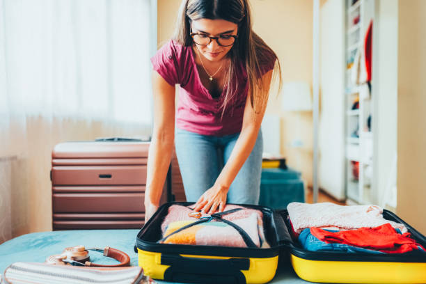 istock Woman packing suitcase for travel 2191659787