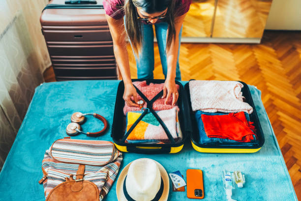 istock Woman packing suitcase for travel 2191659793