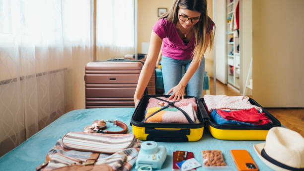 istock Woman packing suitcase for travel 2191659800