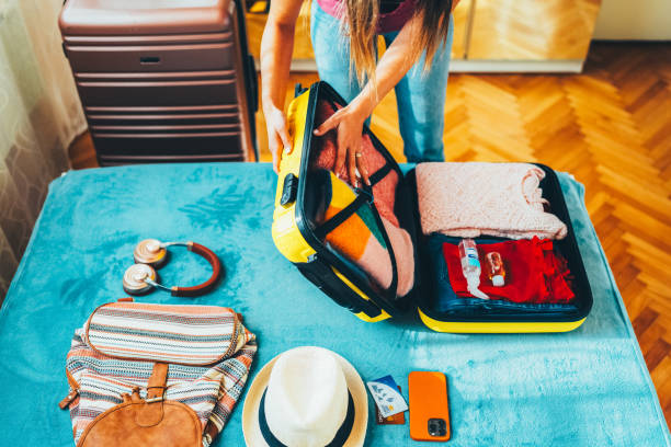 istock Woman packing suitcase for travel 2191659847