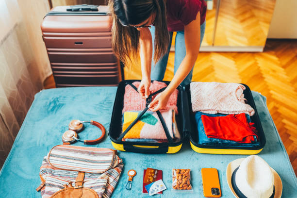 istock Woman packing suitcase for travel 2191659936
