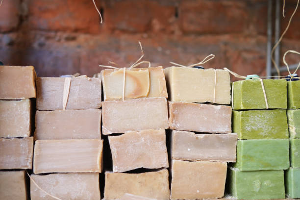 Stunningly arranged and beautifully stacked natural soap bars within a charming artisan workshop
