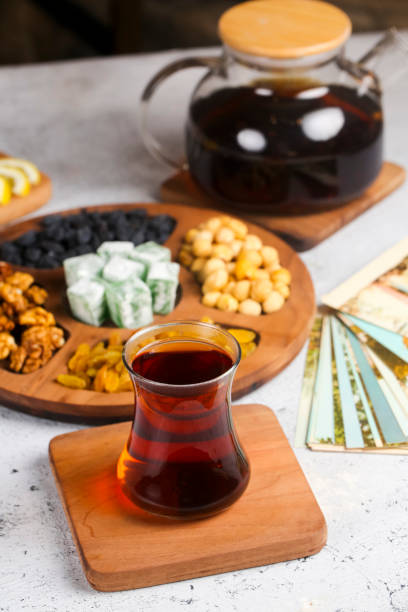 istock Traditional Turkish tea served with assorted snacks on a wooden table 2191661145