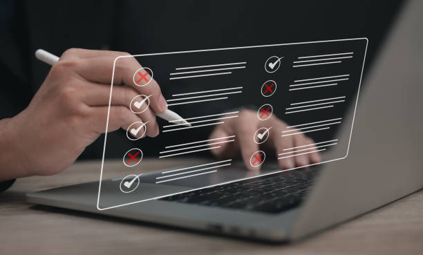 istock Digital Business Survey Checklist : Businessman using Stylus pen with laptop Evaluating Assessments Online , Surveys and Assessments , Maximizing Efficiency or Streamlining Success in the Digital Age 2191662096