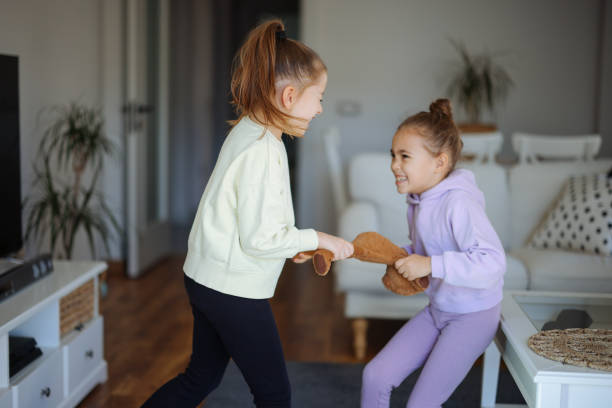 istock Kids are fighting over a toy. Conflict between sister 2191663493