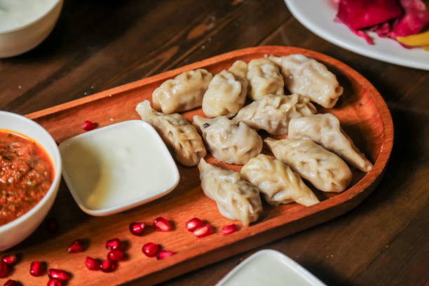 Savory dumplings served with spicy and creamy sauces at local eatery