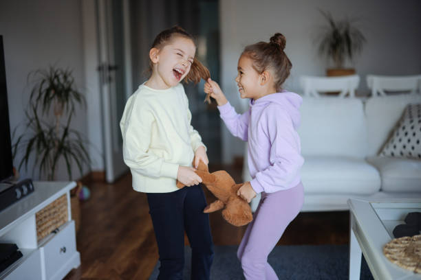 istock Kids are fighting over a toy. Conflict between sister 2191664244