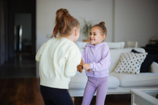 istock Kids are fighting over a toy. Conflict between sister 2191664512