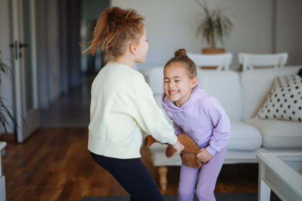 istock Kids are fighting over a toy. Conflict between sister 2191664632