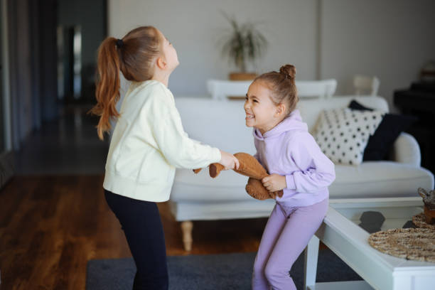 istock Kids are fighting over a toy. Conflict between sister 2191664909