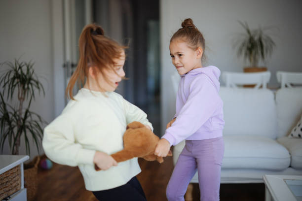 istock Kids are fighting over a toy. Conflict between sister 2191665637