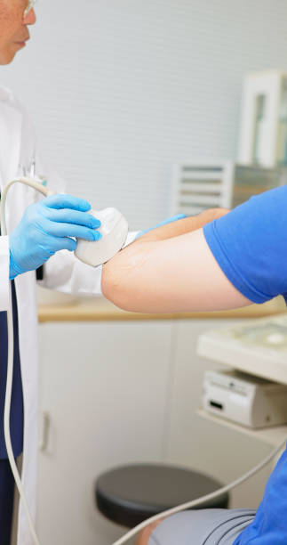 istock asia man elbow injury ultrasound 2191665879