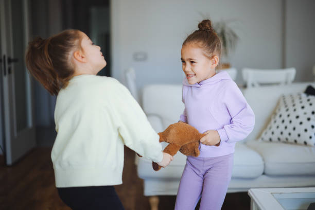 istock Kids are fighting over a toy. Conflict between sister 2191665922