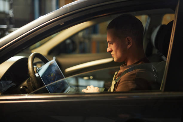 istock Mechanic Doing Car Diagnostics With Laptop 2191666711