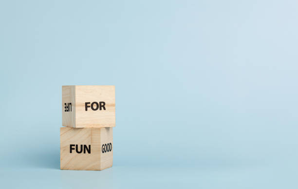 istock Wooden cubes with inscriptions For Fun on a blue background 2191676717