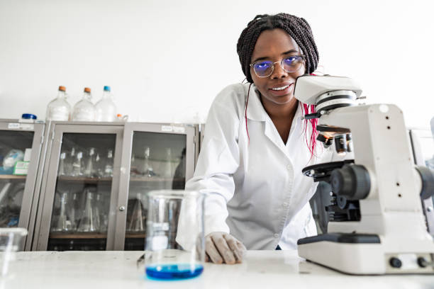 istock Portrait of a scientist woman using a microscope on a laboratory 2191676940