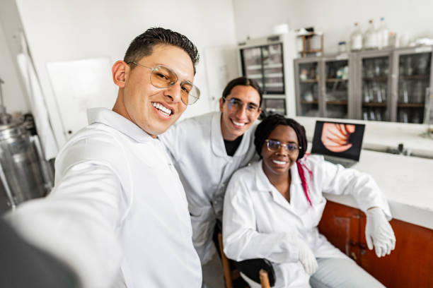 istock Scientists taking a selfie or filming on a laboratory - camera point of view 2191676992