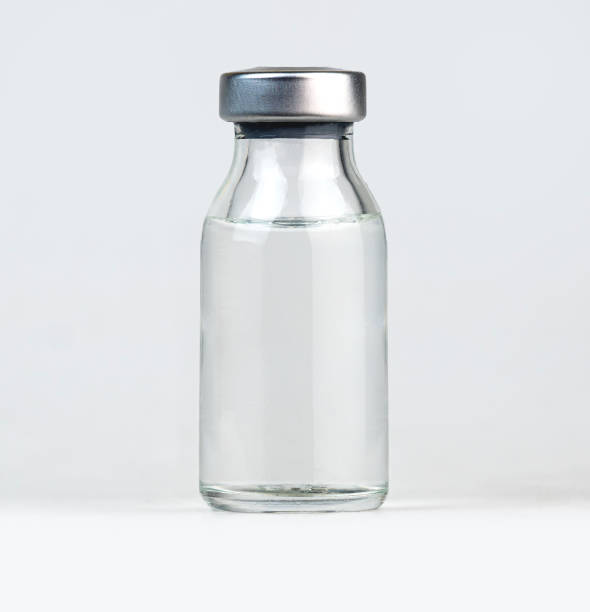 istock Simple glass vial with a metal cap filled with a clear liquid 2191677857