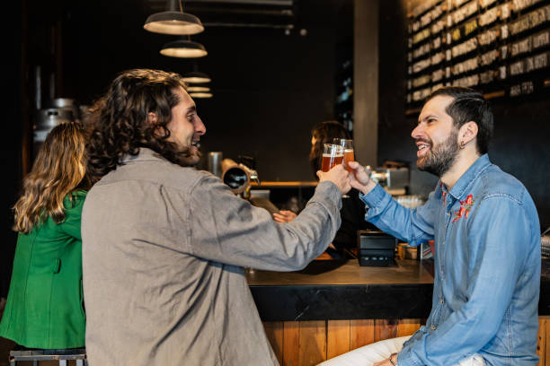 istock Male friends toasting with beer at pub 2191678969