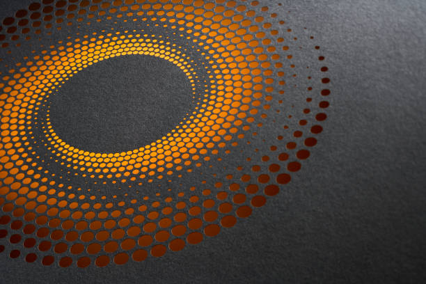 istock Modern paper art featuring concentric orange perforated circles forming a glowing vortex on dark gray background 2191679147