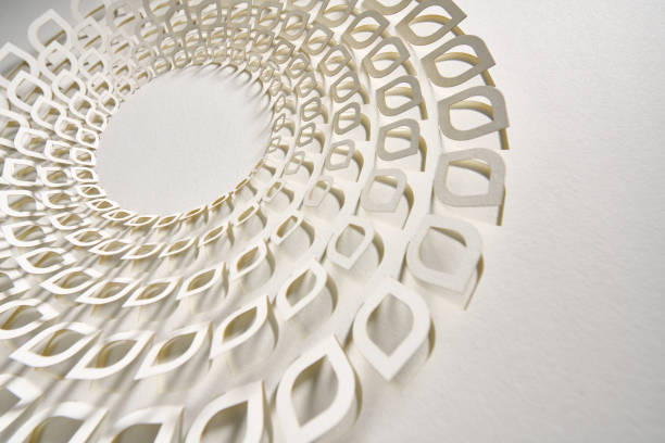 Elegant paper mandala artwork featuring a detailed arrangement of white layered cutouts. The symmetrical design and textured background emphasize the craftsmanship, creating a serene and visually captivating composition.\nNative image size: 7952 x 5304.