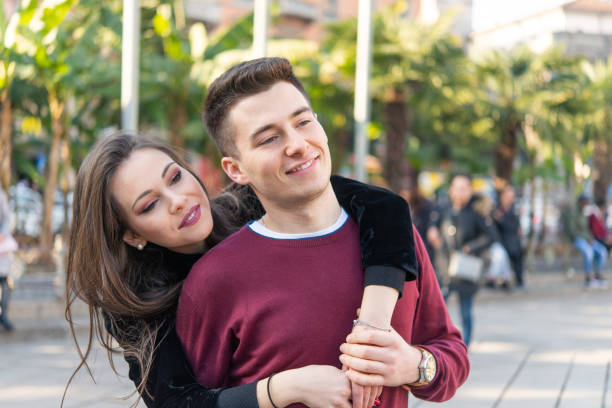 istock Young Couple Embracing in a City Park 2191682870