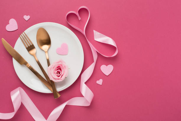 istock Festive table setting for Valentine's Day on color background, top view 2191683024